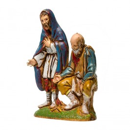 Pastori seduti vicino al Fuoco per il Presepe