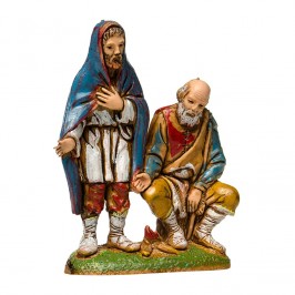 Pastori seduti vicino al Fuoco per il Presepe